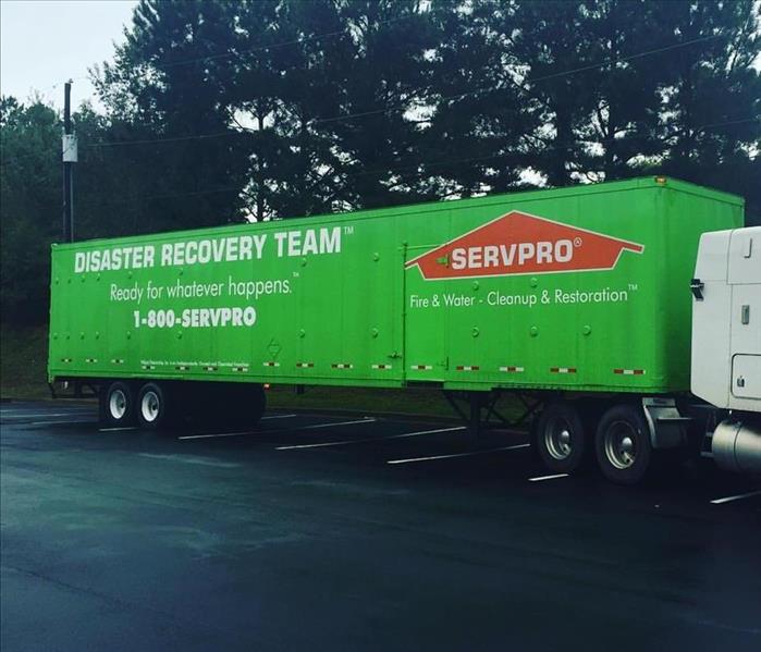 SERVPRO Truck parked in commercial building parking lot 